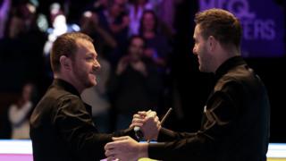 Mark Allen is congratulated by his opponent Mark Selby