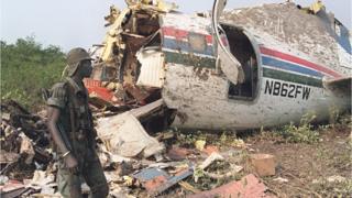 A Senegalese soldier looks at the wreckage of the Convair plane chartered jointly by the French tour operator Club Mediterranee and Air Senegal which crashed in Senegal's southern Casamance region 09 February 1992, killing 24 of the plane's 50 passengers and all six crew members.