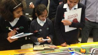 Young reporters from Plashet School looking at how the BBC Micro Bit can be used to programme toy cars