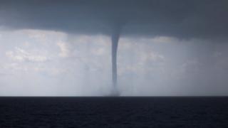 Huge waterspout hits Italy's south-western city - BBC News