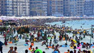 Africa's top shots: 5-11 July 2019 13 People gather at the beach in Egypt's northern coastal city of Alexandria on July 5, 2019.