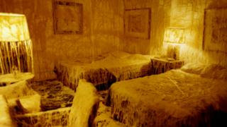 Image showing hotel room covered in melted cheese.