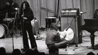 Yoko Ono and John Lennon on stage in Cambridge, March 1969
