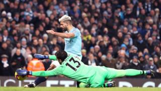 Sergio Aguero of Manchester City strikes hard against Alison Baker's goal