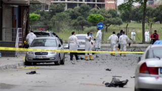 Forensic experts examine a scene of a bomb blast in Istanbul, Turkey. Photo: 12 May 2016
