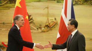 British Foreign Secretary Philip Hammond and Chinese Foreign Minister Wang Yi
