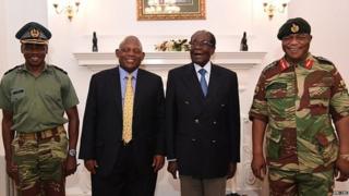 Mr Mugabe (second right) under house arrest, posing alongside Zimbabwe Defence Forces Commander General Constantino Chiwenga (right)