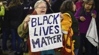 Black Lives Matter protesters chant slogans at the Mall of America light rail station in Bloomington, Minnesota (23 December 2015)
