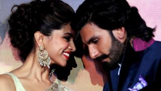 Indian Bollywood film actors Ranveer Singh (R) and Deepika Padukone attend their first look trailer launch of the upcoming romantic-drama Hindi film 'Ram Leela' directed and produced by Sanjay Leela Bhansali in Mumbai on September 16, 2013.