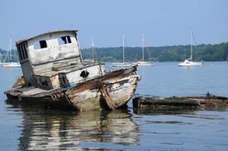 A boat reflected in water