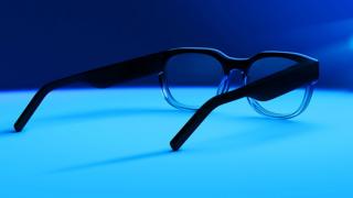 A stock image of North AR glasses on a table lit by blue lights