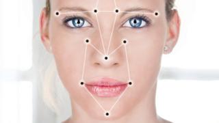 Woman's face superimposed with face detection points