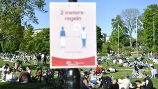 Social distancing signs at a Stockholm park