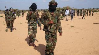 Somali Al-Shabab fighters gather on February 13, 2012 in Elasha Biyaha, in the Afgoei Corridor, after a demonstration to support the merger of Al-shebab and the Al-Qaeda network.