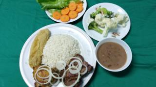   PF rice, beans, stewed meat, fried bananas, salad, cooked broccoli and cauliflower 