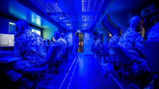 Nato officers monitoring computer screens