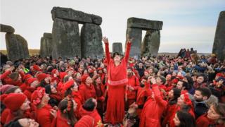 Druids, pagans and revellers gather at Stonehenge, hoping to see the sun rise, as they take part in a winter solstice ceremony at the ancient neolithic monument of Stonehenge