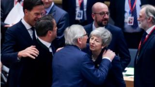 Theresa May greeting Jean-Claude Juncker