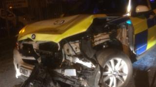 Smashed police car after collision