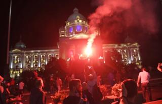 Protesters gather in front of the Serbian Parliament building in Belgrade, Serbia, 08 July 2020