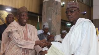 Govnor Ganduje and one of di perm secs