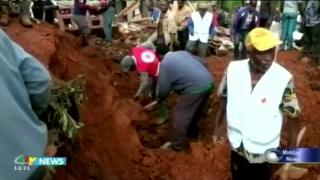 People digging through mud