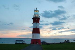 A lighthouse at sunset
