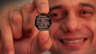 Sajid Javid with the new coin
