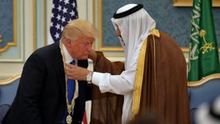 President Donald Trump receives the Order of Abdulaziz al-Saud medal from Saudi Arabia's King Salman bin Abdulaziz al-Saud at the Saudi Royal Court in Riyadh.