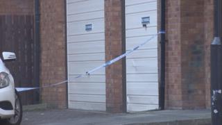 Police tape in Adam Smith Court