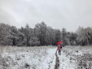A woman walking in the snow near Oxford