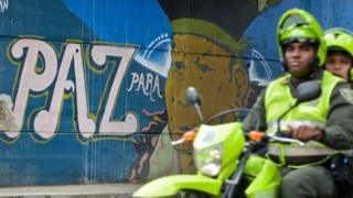 This file photo taken on June 22, 2016 shows a graffiti with a sentence that reads "Peace for the people" in Cali, Colombia, on June 22, 2016