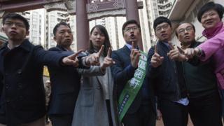 Hong Kong Legislative Council by-election pro-democracy candidate Au Ngok-hin (C) attends an election rally in Aberdeen Square in the Hong Kong Island geographical constituency, Hong Kong, China, 11 March 2018. Hong Kongers go to the polls 11 March 2018 to vote for four new lawmakers after the disqualification of four lawmakers for what Hong Kong"s High Court ruled was improper oath-taking in a swearing-in ceremony after the 04 September 2016 Legislative Council elections. EPA/ALEX HOFFORD