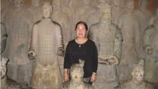 Sandy Phan-Gillis, posing amongst Chinese terracotta soldiers