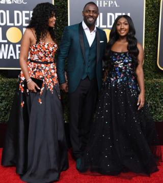 Golden Globe ambassador Isan Elba (R), actor Idris Elba and his fiance Sabrina Dhowre
