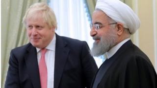 بوريس جونسون والرئيس الإيراني حسن روحاني