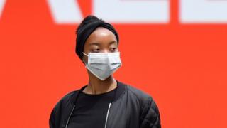 Health Woman wearing a face mask