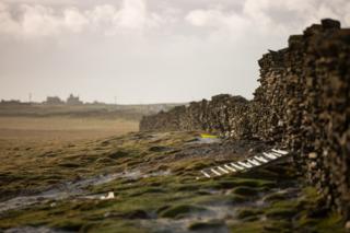 A damaged part of the wall on North Ronaldsay