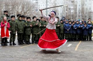 A student performs with model swords