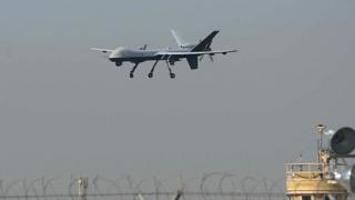 A US drone aircraft lands at Afghanistan's Jalalabad Airport where a US C-130 military transport plane crashed in Jalalabad on October 2, 2015