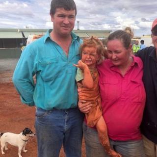 The girl and her family and dog after she was found in the Australian outback