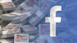 Facebook logo over money