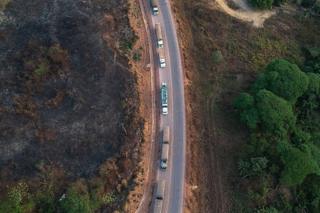 aerial-view-of-the-highway-across-the-amazon-showing-lorries-driving- through-the-middle.