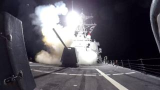A US ship launching strikes on Houthi targets in Yemen