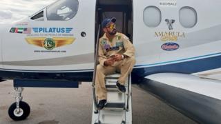 Fakhr-e-Alam sitting by his plane