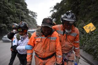 A volunteer firefighter cries