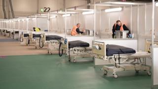 Contractors work at ExCel London, which was converted into the temporary NHS Nightingale Hospital