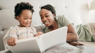 Mum and daughter reading a book