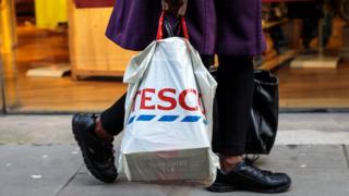 Shopper with a reusable plastic bag from Tesco