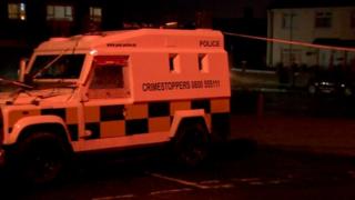 Police vehicle at scene of Monagh Road gun attack